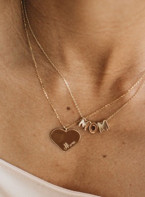 Shop Personalized Jewelry for Mom – Meaningful Gifts She’ll Love Woman wearing gold heart pendant and “Mama” name necklace – personalized Mother’s Day jewelry